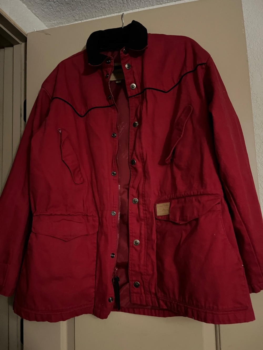 Powder River. Red Jacket with Black Collar